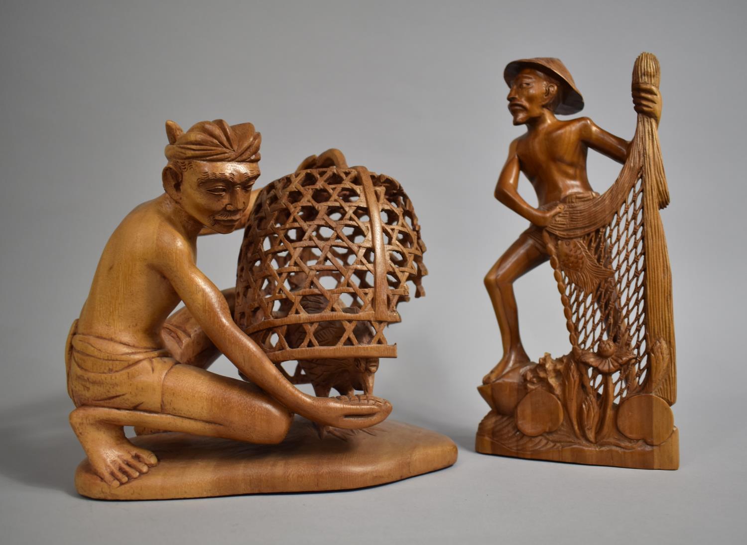 Two Far Eastern Carved Wooden Souvenirs, Gent Feeding Cockerel and Fisherman with Net, 30cms High