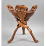 An African Carved Wooden Souvenir, Bowl on Tripod Folding Support with Elephant Finials, 30cms High