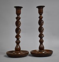 A Pair of Edwardian Oak Candlesticks on Circular Dished Trays, 31cms High