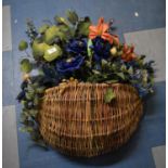 A Wall Hanging Wicker Basket of Artificial Flowers, 50cm wide