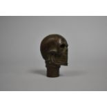 A Reproduction Novelty Bronze Walking Stick Handle in the Form of a Skull, 7cm high