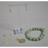 A Modern Jadeite and Silver Pendant on Fine Chain Together with Jade Bead Bracelet and Silver and