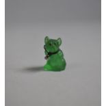 A Small Carved Green Stone Novelty Charm of Seated Dog, 2.5cm high