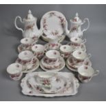 A Royal Albert Lavender Rose Tea Set to comprise Seven Cups, Rectangular Tray, Six Saucers, Six Side