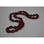 A Faux Cherry Amber Bead Necklace, 80cm Long