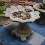 A Reconstituted Stone Garden Bird Bath in the Form of a Clam Shell, 50cm wide and 45cm high