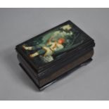 A Large Russian Rectangular Lacquered Box, The Hinged Lid Decorated with Fairy Tale Subject and