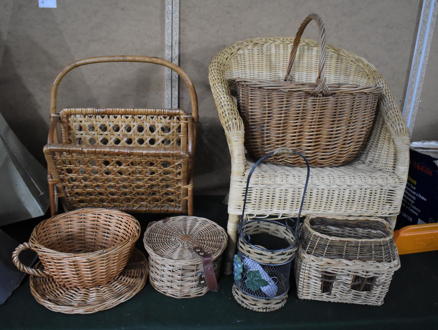 A Collection of Various Wicker Items to Include Child's Chair, Shopping Basket, Magazine Rack etc