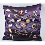 A Satin Cushion Mounted with Ladies Costume Jewellery Brooches