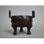 A Chinese Bronze Tripod Censer with Twin Carry Handles, 13cm high