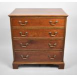 A Reproduction Mahogany Small Chest of Four Graduated Long Drawers, 65cms Wide