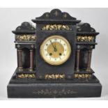 A French Black Slate Mantel Clock of Architectural Form with Gilt Highlights and Reeded Columns with