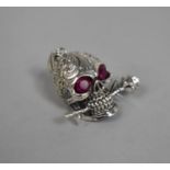 A Miniature Sterling Silver Skull Pendant with Ruby Glass Eyes, 3cm high