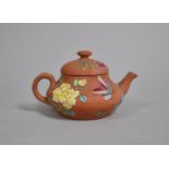 A Small Chinese Yixing Teapot of Squat Form with Applied Enamelled Floral Decoration, 6cm high, (