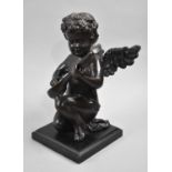 A Modern Cast Metal Study of Kneeling Cherub Playing Mandolin, 23cms High