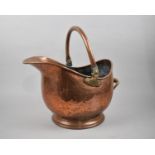 A Late 19th/Early 20th Century Heavy Copper Helmet Shaped Coal Scuttle, 42cms Long