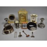 A Collection of Sundries to include Brass Mantel Clocks, Travel Alarm Clocks, Candlesticks, Belts