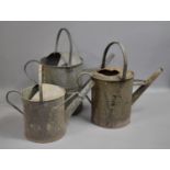 Three Graduated and Galvanised Iron Watering Cans, The Largest 44cms High