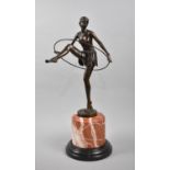 A Large Reproduction Art Deco Bronze of Topless Maiden with Hoop on Circular Marble Base, after D
