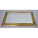 A Large Gilt Framed Rectangular Wall Mirror, 110 by 79cms