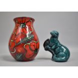 A Poole Delphis Vase and a Poole Otter with Fish, Vase 17cms High