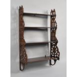 A Reproduction Mahogany Four Shelf Waterfall Wall Hanging Unit with Pierced Supports, 51cms Wide