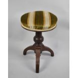 An Edwardian Mahogany Based Circular Rise and Fall Piano Stool on Tripod Support