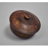 A Circular Oriental Lacquered Papier Mache Lidded pot with Gilt Decoration, 13cms Diameter