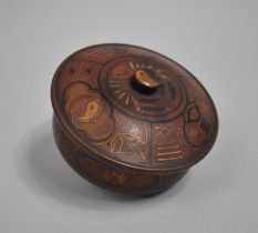 A Circular Oriental Lacquered Papier Mache Lidded pot with Gilt Decoration, 13cms Diameter