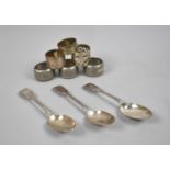 A Collection of Pewter and Silver Plated Napkin Rings and Three Spoons