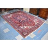 A Persian Hand Made Heriz Carpet, 337x240cms