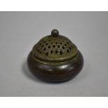 A Circular Oriental Bronze Censer with Pierced Lid, 10cms Diameter