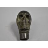 A Novelty Bronze Walking Stick Handle in the Form of a Skull, 7cms High