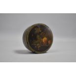 A 19th Century Transfer Printed Circular Lidded Lacquered Box decorated with Fruit, 7cms Diameter