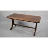 A Modern Cross Banded Mahogany Coffee Table, 90cms by 45cms