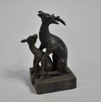 A Reproduction Novelty Bronze Oriental Two Part Desk Top Seal in the Form of Stag and Hind Mating,
