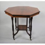 An Edwardian String inlaid Walnut and Mahogany Octagonal Occasional Table with Stretcher Shelf,