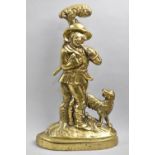 A Late 19th Century Weighted Brass Door Porter in the Form of Woodsman Carrying Axe with Dog at