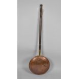 A Mid 20th Century Copper Bed Warming Pan with Turned Wooden Handle.