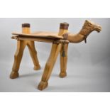 A Mid 20th Century Souvenir Camel Saddle Stool, 64cms Long