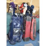 Four Vintage Golf Bags Containing Drivers and Golfing Irons