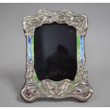 A Silver Mounted Photo Frame, Missing Glass, 20cms High and 16cms Wide