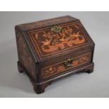 A Dutch Marquetry Miniature Bureau with a Four Drawer Fitted Interior over a Single Drawer and