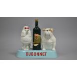 A Beswick Dubonnet Advertising Promotion, Dubonnet Bottle Flanked by Poodle and Bulldog on Blue