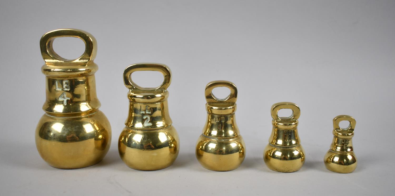 A Set of Five Graduated Brass Bell Weights, The Heaviest 4lbs