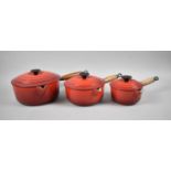 A Collection of Three Graduated Le Creuset Lidded Saucepans, Largest 22cms Diameter
