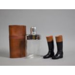 A Mid 20th Century Leather Covered Glass Hip Flask with Pair of Glazed Terracotta Riding Boots,