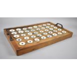 A Late 19th/Early 20th Century School Inkwell Tray with Forty Ceramic Inkwells, Brass Carry Handles,