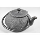 An Oriental Cast Iron Teapot, with Three Character Mark Under Spout, 17cms High