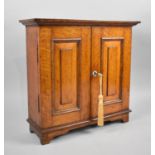 A Late 19th/Early 20th Century Oak Shelved Cabinet with Panelled Doors and Bracket Feet, 39x13x37cms